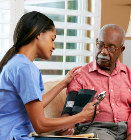 caregiver checking a senior man
